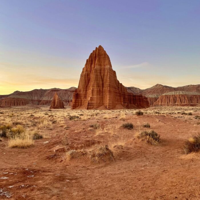 sunrise lighting on the temples of the sun and moon, inside the cathedral valley capitol reef national park