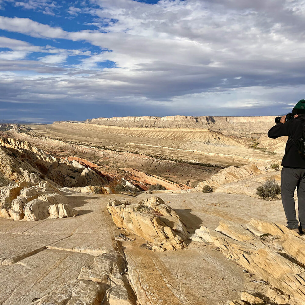 photographer taking photo of strike valley, inside capitol reef national park